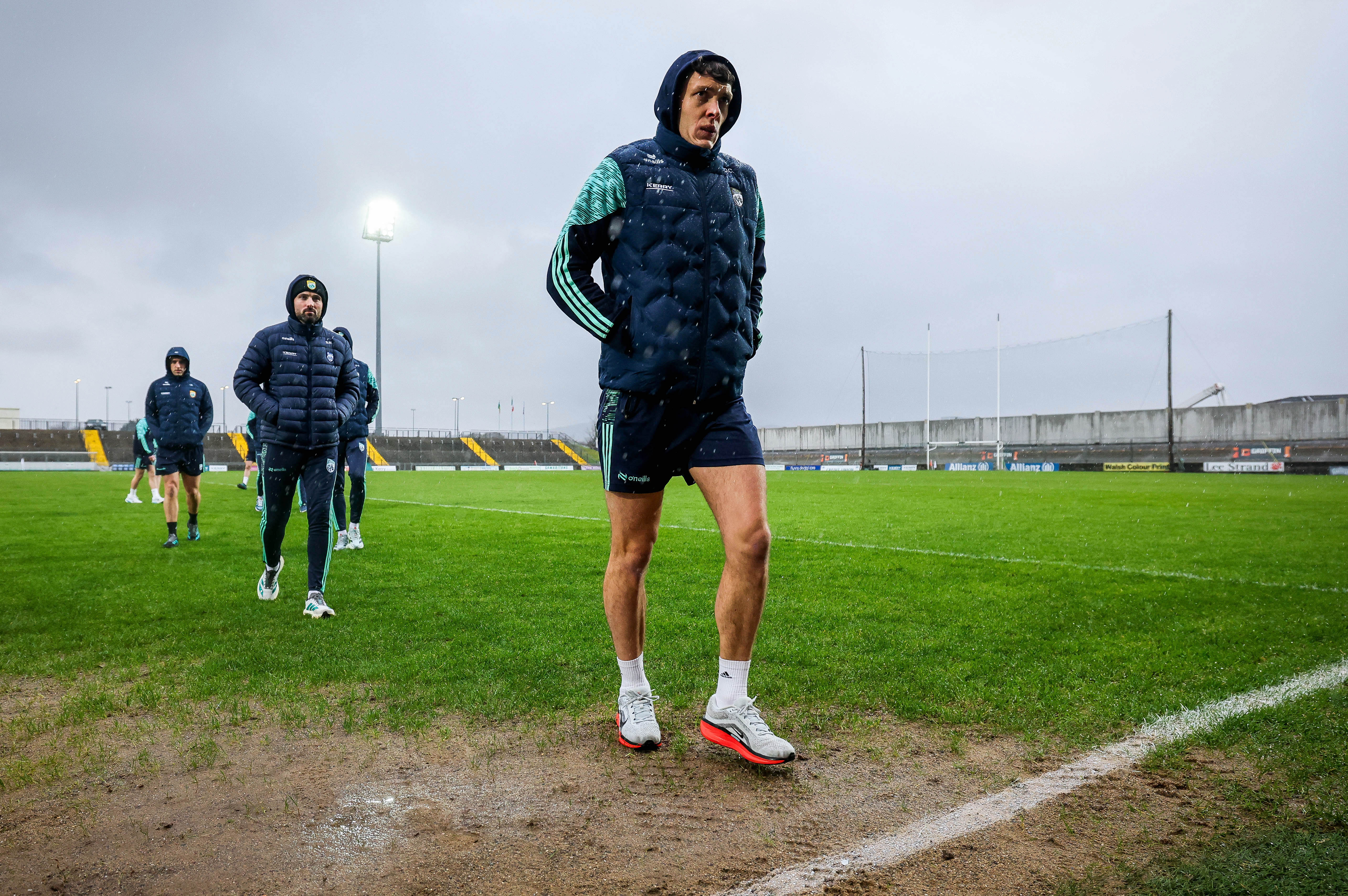 GAA player on pitch in the rain