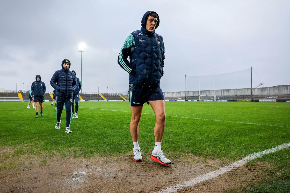 GAA player on pitch in the rain