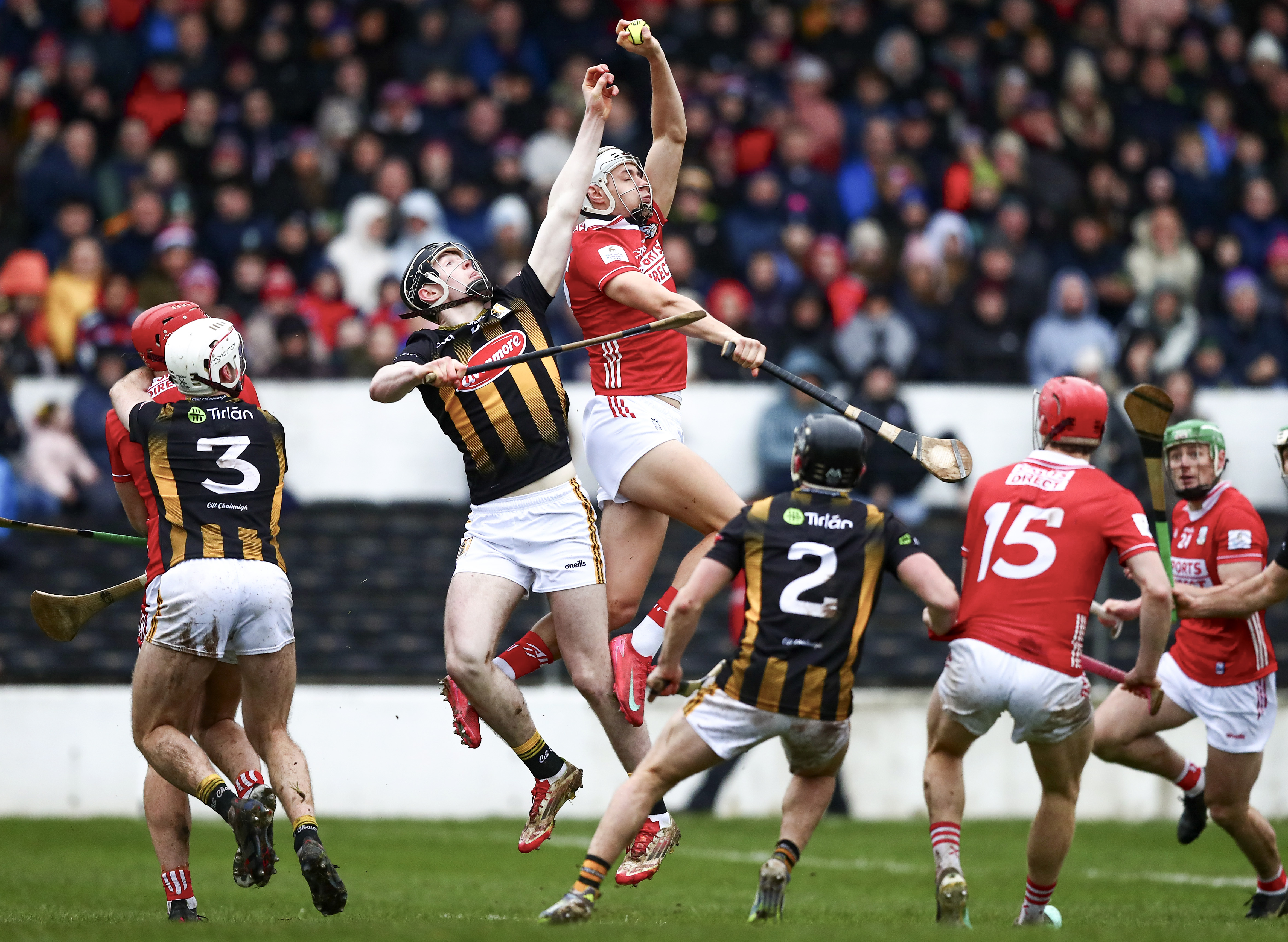 Hurlers battling for possession during a championship match