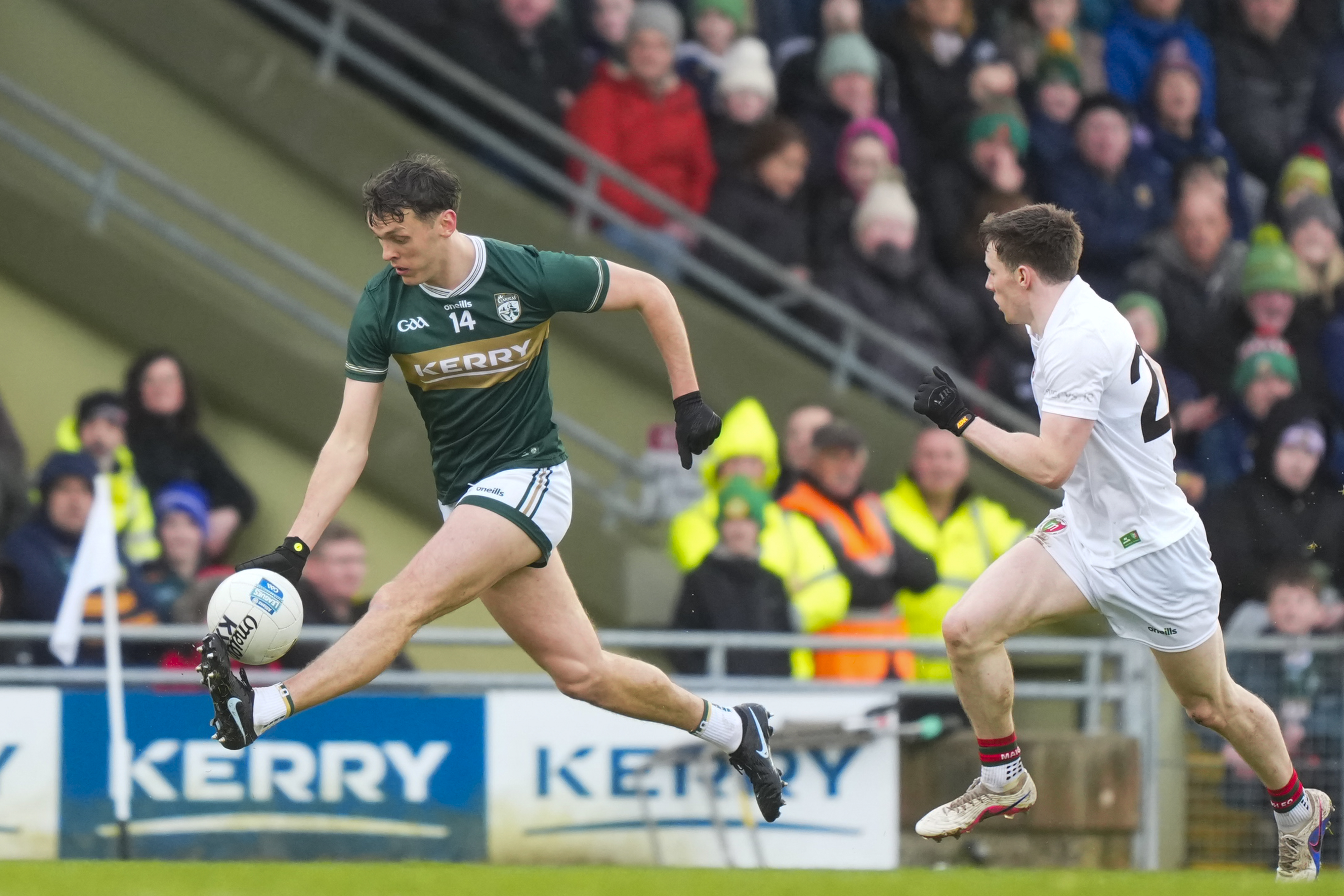 GAA player bursting past a defender during a championship match
